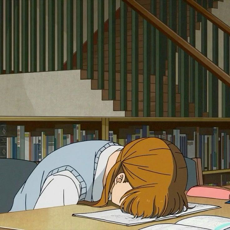 Brown-haired girl slumped over a desk